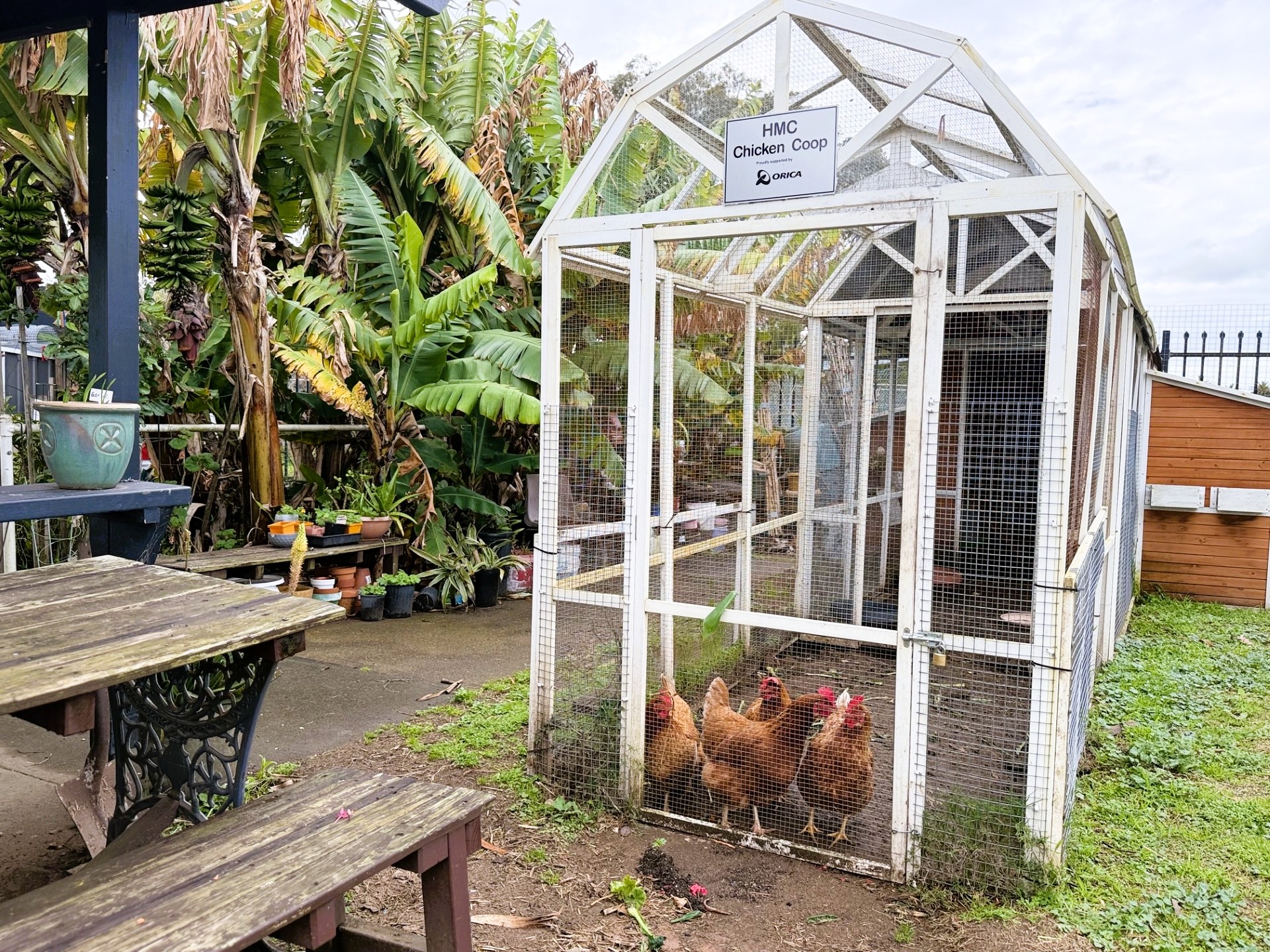 Families gathered at the HMC community garden entrance