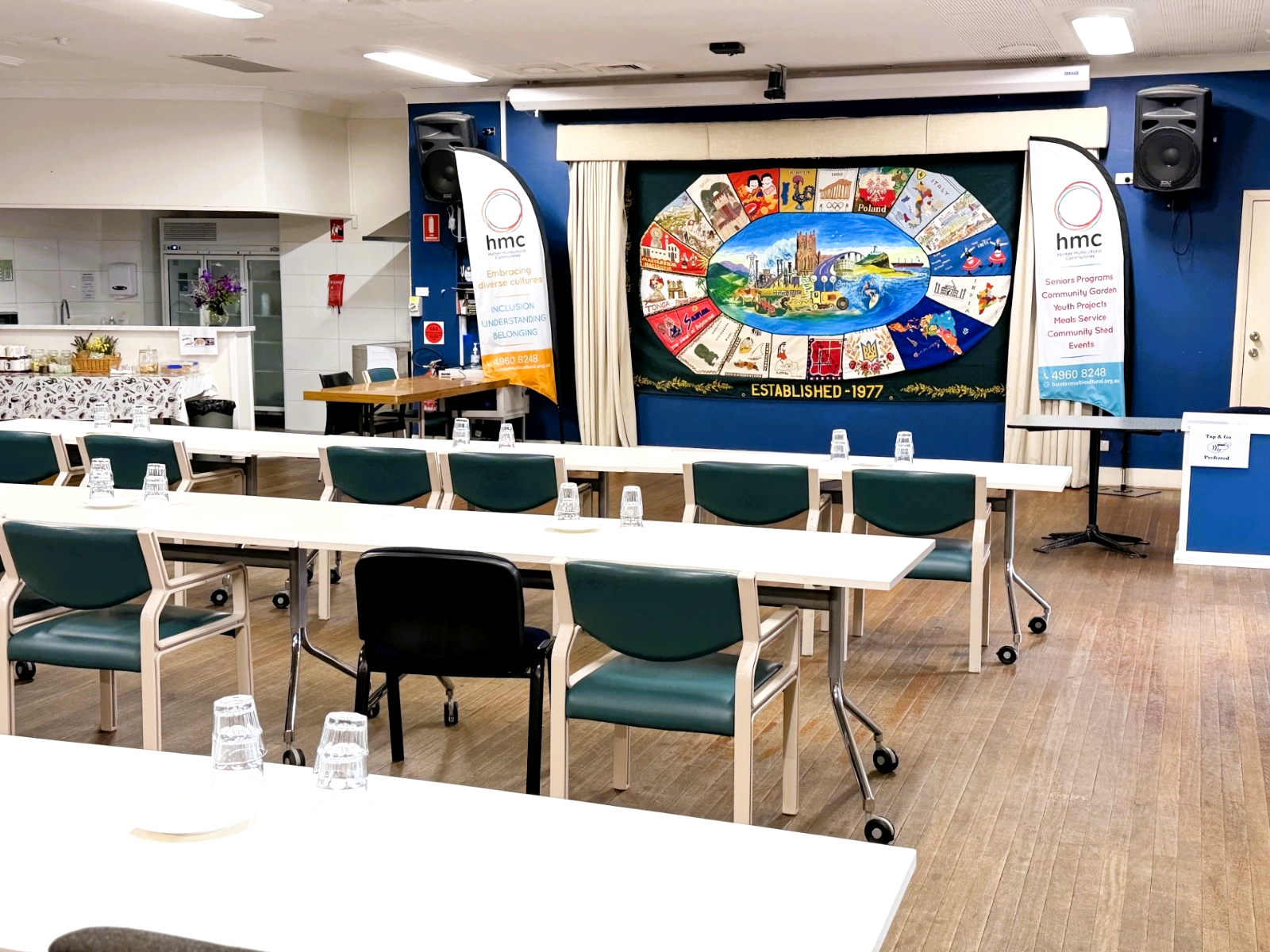 HMC hall set up with tables and chairs